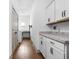 Well-lit laundry room with ample counter space and modern appliances at 16012 Forewood Ln, Fishers, IN 46037