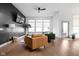 Modern living room with a black accent wall, stylish furnishings, and a view of the outdoors at 16012 Forewood Ln, Fishers, IN 46037