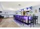 Finished basement with a well-stocked bar, multiple TVs, and ample seating at 16457 Anderson Way, Noblesville, IN 46062