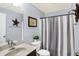 Charming bathroom with a shower-tub combo, vanity with sink, and decorative accents at 16457 Anderson Way, Noblesville, IN 46062
