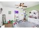 Bright bedroom with carpet, ceiling fan, and adjacent doorway leading to another room at 16457 Anderson Way, Noblesville, IN 46062