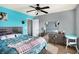 A colorful bedroom featuring a queen bed, a ceiling fan, and a large dresser at 16457 Anderson Way, Noblesville, IN 46062