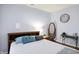 Bedroom with a bed with blue pillows, nightstand, floor mirror and decorative clock at 16457 Anderson Way, Noblesville, IN 46062