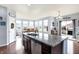 Modern kitchen with stainless steel appliances and an island with a granite countertop at 16457 Anderson Way, Noblesville, IN 46062