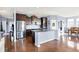 Modern kitchen with stainless steel appliances and an island with a granite countertop at 16457 Anderson Way, Noblesville, IN 46062