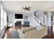 Bright living room featuring a fireplace, large windows, and modern decor at 16457 Anderson Way, Noblesville, IN 46062