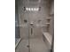 Spacious walk-in shower with dual shower heads, bench, and tiled surround at 16457 Anderson Way, Noblesville, IN 46062