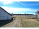 A white barn with an adjacent silo and plenty of room to roam at 22351 Cyntheanne Rd, Noblesville, IN 46060