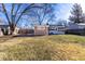 Spacious backyard featuring a shed and mature trees creating a serene and private outdoor space at 3144 Voigt Dr, Indianapolis, IN 46224