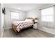 Bright bedroom with a wooden bed frame, heart patterned bedding, and a white nightstand at 3144 Voigt Dr, Indianapolis, IN 46224