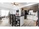 Spacious kitchen with stainless steel appliances, an island with seating, and views to the living area at 3144 Voigt Dr, Indianapolis, IN 46224