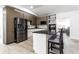 Modern kitchen with stainless steel appliances, sleek countertops, and island with seating at 3144 Voigt Dr, Indianapolis, IN 46224