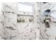 Marble-tiled shower with built-in niche and window for natural light and organization at 3144 Voigt Dr, Indianapolis, IN 46224