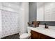 Modern bathroom with dark vanity and hexagon tile floor at 317 N Arsenal Ave, Indianapolis, IN 46201