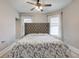 Spacious bedroom with a large tufted headboard and window at 317 N Arsenal Ave, Indianapolis, IN 46201