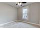 Well-lit bedroom featuring a large window and neutral walls at 317 N Arsenal Ave, Indianapolis, IN 46201