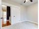 Bedroom with double doors and access to an upper hallway at 317 N Arsenal Ave, Indianapolis, IN 46201