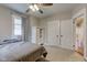 Bedroom with built-in shelving and double doors to the hallway at 317 N Arsenal Ave, Indianapolis, IN 46201