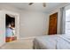 Bedroom with an antique door and access to upstairs hallway at 317 N Arsenal Ave, Indianapolis, IN 46201