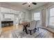 Dining area with wooden table and view into kitchen at 317 N Arsenal Ave, Indianapolis, IN 46201