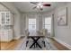 Bright dining room with wood table and bay windows at 317 N Arsenal Ave, Indianapolis, IN 46201