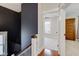 Upper hallway with access to bedrooms and updated finishes at 317 N Arsenal Ave, Indianapolis, IN 46201
