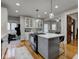 Bright kitchen boasts an island, white cabinets, and gray backsplash at 317 N Arsenal Ave, Indianapolis, IN 46201