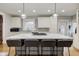 Modern kitchen with white cabinets and large island at 317 N Arsenal Ave, Indianapolis, IN 46201