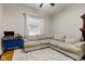Living room with sectional sofa and wood floors at 317 N Arsenal Ave, Indianapolis, IN 46201