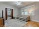 Living room with L-shaped sofa, hardwood floors, and pocket doors at 317 N Arsenal Ave, Indianapolis, IN 46201