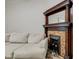 Light-filled living room featuring a comfy couch and a fireplace at 317 N Arsenal Ave, Indianapolis, IN 46201