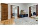 Open living area with pocket doors opening to other rooms at 317 N Arsenal Ave, Indianapolis, IN 46201