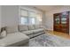 Relaxing living room with L-shaped couch and hardwood floors at 317 N Arsenal Ave, Indianapolis, IN 46201