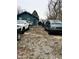 Backyard filled with many parked cars and covered with gravel at 3306 N Drexel Ave, Indianapolis, IN 46218
