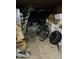 Dim basement cluttered with boxes, tires, and bicycles at 3306 N Drexel Ave, Indianapolis, IN 46218