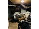 Messy basement with washer and dryer and items piled on top of a table at 3306 N Drexel Ave, Indianapolis, IN 46218