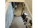 Stairs leading down to an unfinished basement with gray concrete walls at 3306 N Drexel Ave, Indianapolis, IN 46218