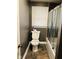 The bathroom has standard fixtures and slate look flooring at 3306 N Drexel Ave, Indianapolis, IN 46218