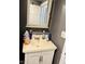 This standard bathroom has a vanity and mirror at 3306 N Drexel Ave, Indianapolis, IN 46218