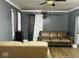 Comfortable living room features stylish gray walls, wood-look floors, and a warm color scheme at 3306 N Drexel Ave, Indianapolis, IN 46218