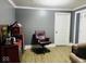 This small office area has wood look flooring and a vintage Route 66 sign at 3306 N Drexel Ave, Indianapolis, IN 46218