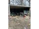 Disorganized storage area filled with various tools, equipment, and miscellaneous discarded items at 3306 N Drexel Ave, Indianapolis, IN 46218