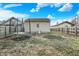 Backyard featuring a detached garage with an AC unit and a trampoline at 3933 Byram Ave, Indianapolis, IN 46208