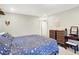 Comfortable bedroom featuring a dresser, makeup table, and a cozy bed with a stylish comforter at 3933 Byram Ave, Indianapolis, IN 46208