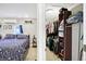 View of the main bedroom leading into a walk-in closet, offering ample storage and organization solutions at 3933 Byram Ave, Indianapolis, IN 46208