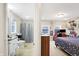 A spacious bedroom that joins to an ensuite bathroom and an inviting study area for a private retreat at 3933 Byram Ave, Indianapolis, IN 46208