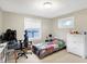 Bright bedroom with a single bed, white dresser and good natural light at 3933 Byram Ave, Indianapolis, IN 46208