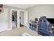 Bedroom featuring a closet, bed, shelves and neutral carpeting at 3933 Byram Ave, Indianapolis, IN 46208