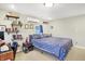 Bedroom featuring a queen bed, built-in shelves, and a workspace at 3933 Byram Ave, Indianapolis, IN 46208