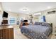 Bright bedroom features built-in shelves, a ceiling fan, and natural light at 3933 Byram Ave, Indianapolis, IN 46208